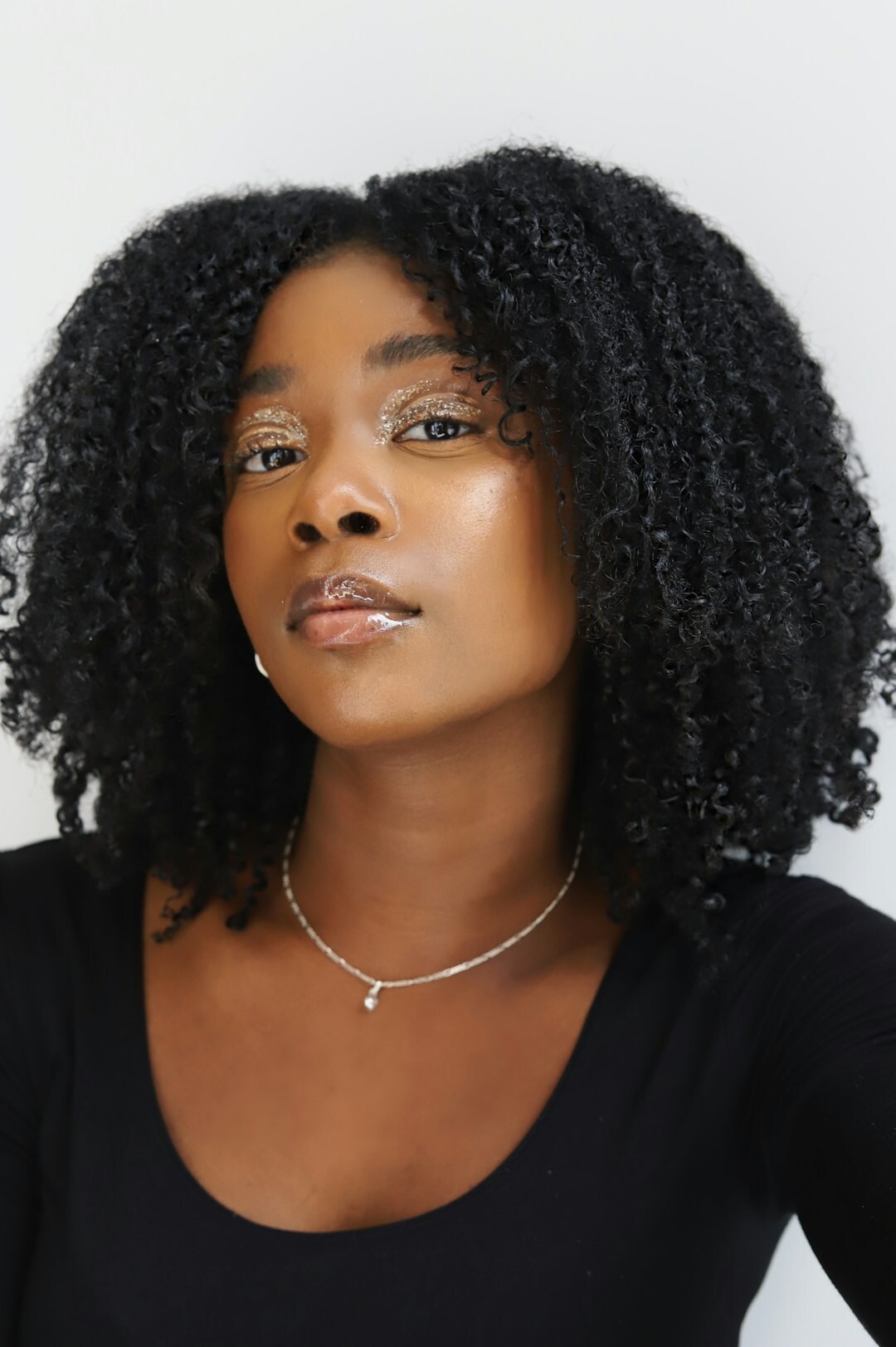 Studio portrait of a North African businesswoman with dark curly hair